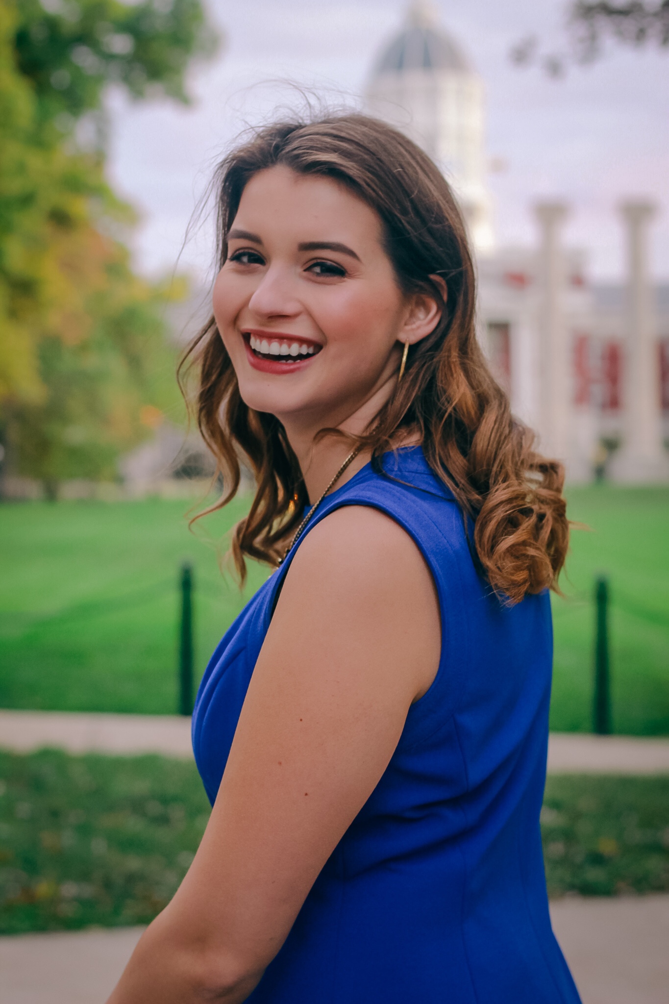 Lindsey smiles at the camera while standing near the Francis Quadrangle at Mizzou.