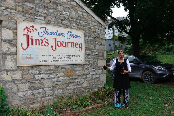 photo of Faye Dant infrot of her museum.